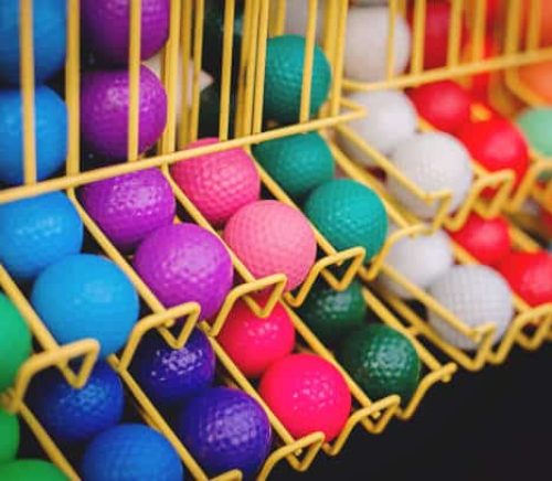 Colorful golf balls at family miniature golf